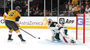Apr 20, 2025; Las Vegas, Nevada, USA; Vegas Golden Knights center Jack Eichel (9) shoots against Minnesota Wild goaltender Filip Gustavsson (32) during the second period of  game one of the first round of the 2025 Stanley Cup Playoffs at T-Mobile Arena. Mandatory Credit: Stephen R. Sylvanie-Imagn Images
