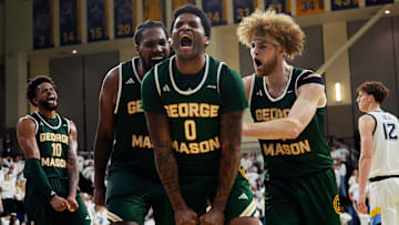 George Mason Patriots forward Jalen Haynes (11), guard K.D. Johnson (0), and guard Brayden O'Connor (4)