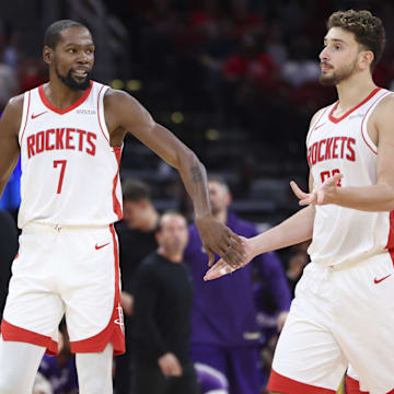 Oct 8, 2025; Houston, Texas, USA; Houston Rockets forward Kevin Durant (7) reacts with center Alperen Sengun (28) after a play during the third quarter against the Utah Jazz at Toyota Center. Mandatory Credit: Troy Taormina-Imagn Images