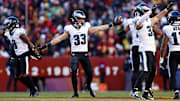 Dec 22, 2024; Landover, Maryland, USA; Philadelphia Eagles cornerback Cooper DeJean (33) celebrates after recovering a fumble during the second quarter against the Washington Commanders at Northwest Stadium. Mandatory Credit: Peter Casey-Imagn Images
