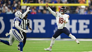 Sep 22, 2024; Indianapolis, Indiana, USA; Chicago Bears quarterback Caleb Williams (18) throws the ball over Indianapolis Colts linebacker Zaire Franklin (44) during the first quarter at Lucas Oil Stadium. Mandatory Credit: Marc Lebryk-Imagn Images

