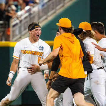 Jun 14, 2024; Omaha, NE, USA; The Tennessee Volunteers celebrate after a walk off single by left fielder Dylan Dreiling (8) against the Florida State Seminoles at Charles Schwab Filed Omaha. Mandatory Credit: Dylan Widger-USA TODAY Sports