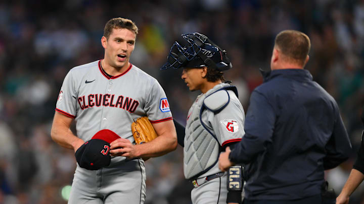 Cleveland Guardians relief pitcher Smith is checked on after being hit by the ball against the Seattle Mariners at T-Mobile Park. 