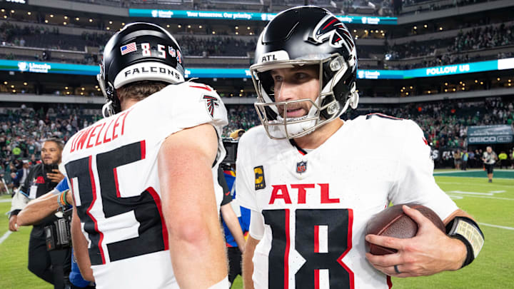 Sep 16, 2024; Philadelphia, Pennsylvania, USA; Atlanta Falcons quarterback Kirk Cousins (18) hugs tight end Ross Dwelley (85) after a victory against the Philadelphia Eagles at Lincoln Financial Field. Mandatory Credit: Bill Streicher-Imagn Images