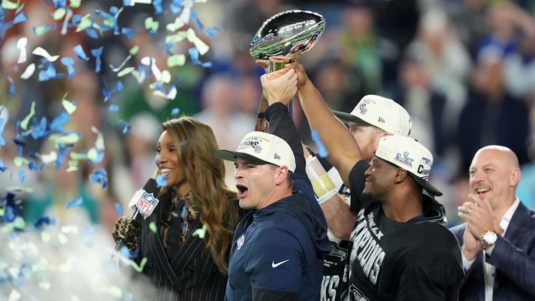 Feb 8, 2026; Santa Clara, CA, USA;  Seattle Seahawks head coach Mike MacDonald and Seattle Seahawks running back Kenneth Walker III (9) hoist the Vince Lombardi Trophy after defeating the New England Patriots in Super Bowl LX at Levi's Stadium. Mandatory Credit: Kirby Lee-Imagn Images