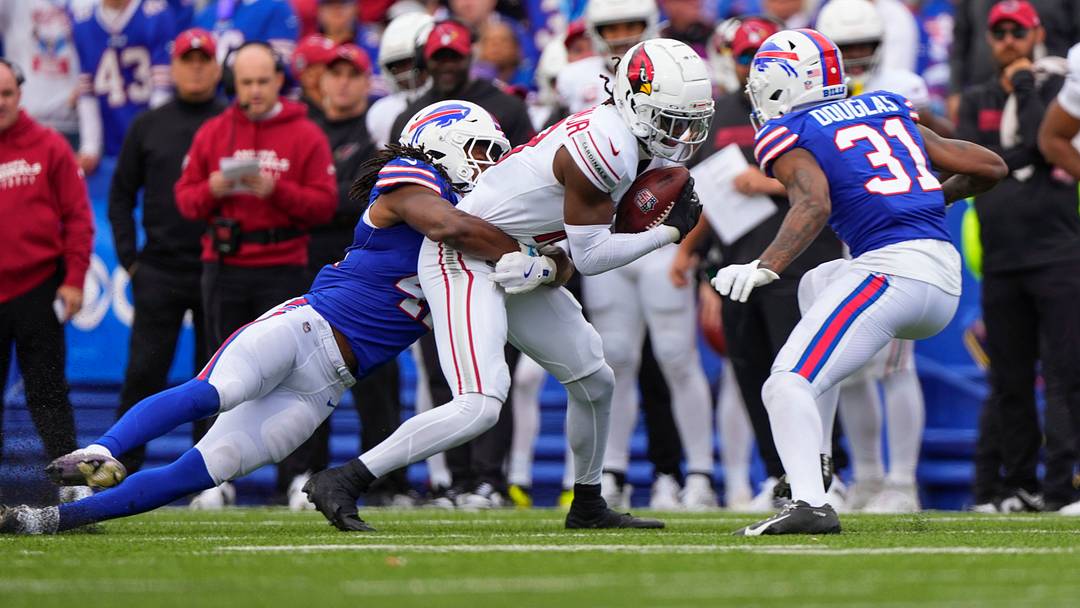 Sep 8, 2024; Orchard Park, New York, USA; Buffalo Bills linebacker Dorian Williams (42) and Buffalo Bills cornerback Rasul Douglas (31) tackle Arizona Cardinals wide receiver Marvin Harrison Jr. (18) 