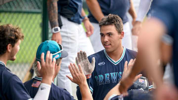 COTUIT 07/09/24 Daniel Cuvet celebrates with Brewster teammates after a solo homerun that put them up 3-1 against Cotuit Cape League baseball Ron Schloerb/Cape Cod Times