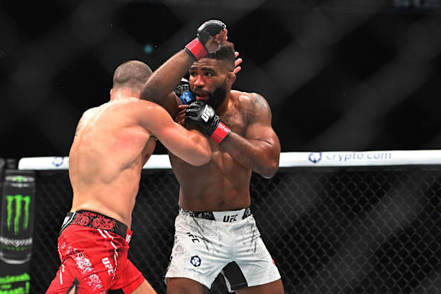 Chris Curtis (red glove) fights Marc-Andre Barriault (blue gloves) during UFC 297 at ScotiaBank Arena. 