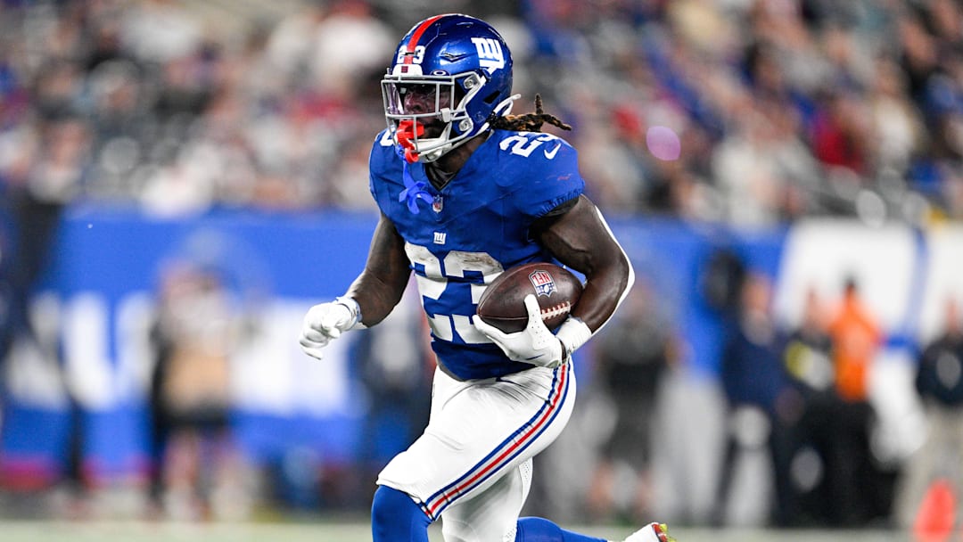 Aug 21, 2025; East Rutherford, New Jersey, USA; New York Giants running back Jonathan Ward (23) runs for a touchdown during the third quarter against the New England Patriots at MetLife Stadium. Mandatory Credit: Mark Smith-Imagn Images