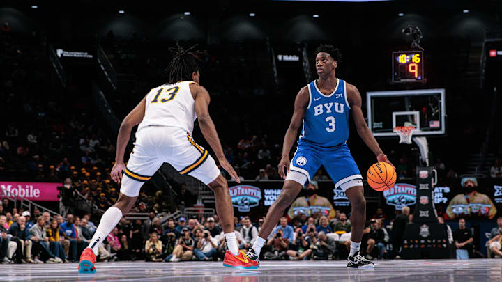Mar 11, 2026; Kansas City, MO, USA; BYU Cougars forward AJ Dybantsa (3) brings the ball up court around West Virginia Mountaineers guard Chance Moore (13) during the second half at T-Mobile Center. Mandatory Credit: William Purnell-Imagn Images