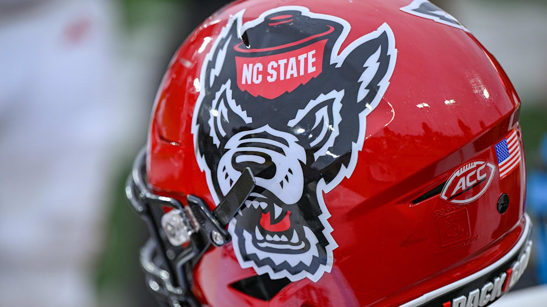Nov 11, 2023; Winston-Salem, North Carolina, USA; The North Carolina State Wolfpack helmet rests on the bench during the second half against the Wake Forest Demon Deacons at Allegacy Federal Credit Union Stadium. Mandatory Credit: William Howard-Imagn Images