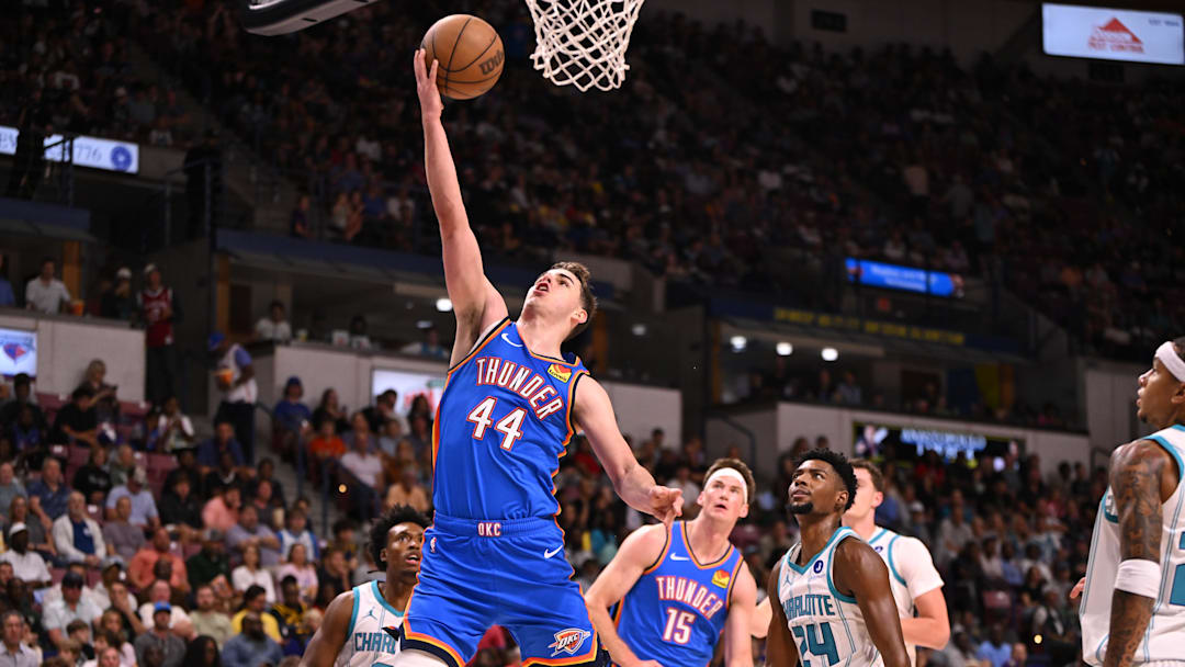 Oct 5, 2025; North Charleston, South Carolina, USA; Oklahoma City Thunder guard Nikola Topic (44) lays up a shot against the Charlotte Hornets in the first quarter at North Charleston Coliseum. Mandatory Credit: Arthur Ellis-Imagn Images