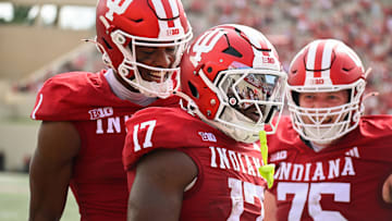 Aug 31, 2024; Bloomington, Indiana, USA;  Indiana Hoosiers running back Ty Son Lawton (17) celebrates with Donaven McCulley (1) and Trey Wedig (75) after running for a touchdown against the Florida International Panthers during the first half at Memorial Stadium. Mandatory Credit: Robert Goddin-Imagn Images