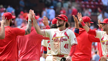 Jun 22, 2024; St. Louis, Missouri, USA;  St. Louis Cardinals outfielder Alec Burleson (41) congratulates teammates after the last out. He hit two home runs during the game against the San Francisco Giants at Busch Stadium. Mandatory Credit: Tim Vizer-USA TODAY Sports