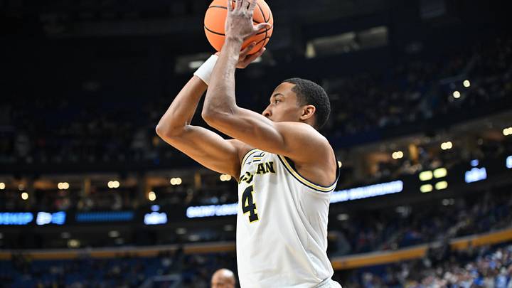 Mar 21, 2026; Buffalo, NY, USA; Michigan Wolverines guard Nimari Burnett (4) shoots in the second half against the Saint Louis Billikens during a second round game of the men's 2026 NCAA Tournament at Keybank Center. Mandatory Credit: Mark Konezny-Imagn Images