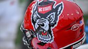 Nov 11, 2023; Winston-Salem, North Carolina, USA; The North Carolina State Wolfpack helmet rests on the bench during the second half against the Wake Forest Demon Deacons at Allegacy Federal Credit Union Stadium. Mandatory Credit: William Howard-Imagn Images