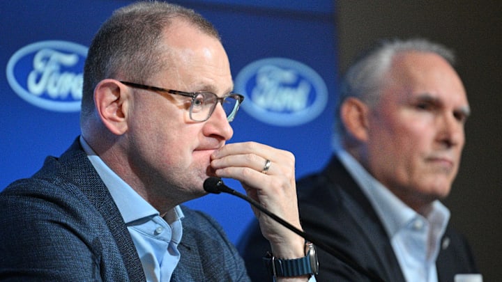 May 21, 2024; Toronto, Ontario, CANADA;  Toronto Maple Leafs general manager Brad Treliving listens to a question during a media conference to introduce new head coach Craig Berube (right) at Ford Performance Centre. Mandatory Credit: Dan Hamilton-Imagn Images