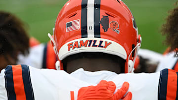 Oct 14, 2023; College Park, Maryland, USA;  Illinois Fighting Illini linebacker Gabe Jacas (17) huddles along the sidelines with teammates before the game against the Maryland Terrapins.