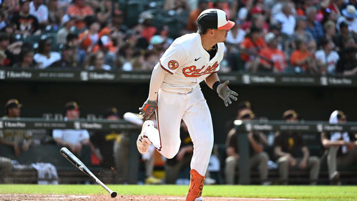 Jul 28, 2024; Baltimore, Maryland, USA;  Baltimore Orioles first baseman Ryan Mountcastle (6) hits a 2-RBI single during the eighth inning against the San Diego Padres at Oriole Park at Camden Yards. Mandatory Credit: James A. Pittman-USA TODAY Sports