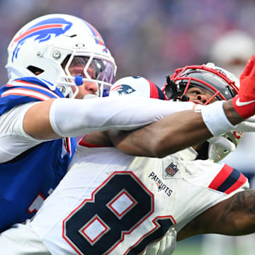 Dec 31, 2023; Orchard Park, New York, USA; Buffalo Bills cornerback Taron Johnson breaks up a pass intended for New England Patriots wide receiver DeMario Douglas (81) in the second quarter at Highmark Stadium.