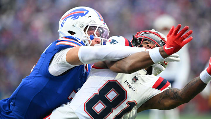 Dec 31, 2023; Orchard Park, New York, USA; Buffalo Bills cornerback Taron Johnson breaks up a pass intended for New England Patriots wide receiver DeMario Douglas (81) in the second quarter at Highmark Stadium.