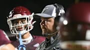 Niceville High School Football Coach Grant Thompson talks with his team during Friday's Kickoff Classic against Lincoln High School at Niceville.