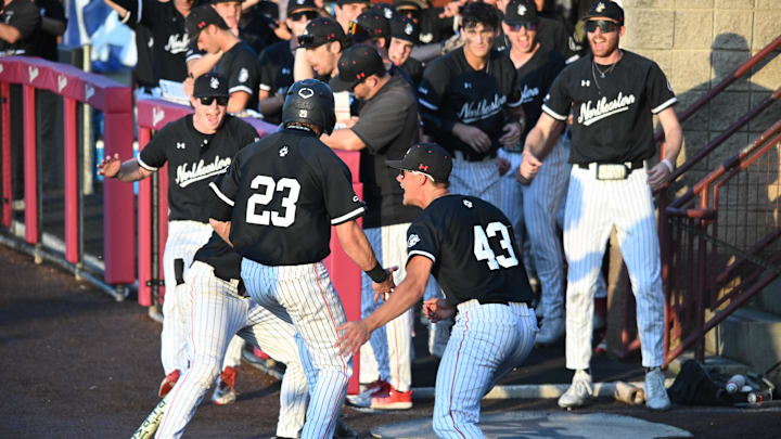 May 24, 2025; Mt. Pleasant, SC, USA; Action image of UNCW and Northeastern University during the CAA Baseball Championships at College of Charleston Baseball Stadium. Mandatory Credit: Arthur Ellis-Imagn Images