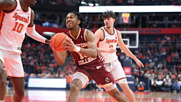 Feb 8, 2025; Syracuse, New York, USA; Boston College Eagles guard Donald Hand Jr. (13) looks to the basket to take a shot as Syracuse Orange center Naheem McLeod (10) and forward Petar Majstorovic (6) defend in the first half at the JMA Wireless Dome. Mandatory Credit: Mark Konezny-Imagn Images