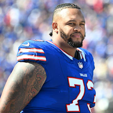 Sep 28, 2025; Orchard Park, New York, USA;  Buffalo Bills offensive tackle Dion Dawkins (73) on the sidelines during the second quarter against the New Orleans Saints at Highmark Stadium.