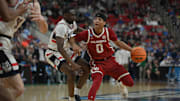 Mar 21, 2025; Raleigh, NC, USA;  Oklahoma Sooners guard Jeremiah Fears (0) controls the ball against Connecticut Huskies during the second half at Lenovo Center. Mandatory Credit: Zachary Taft-Imagn Images