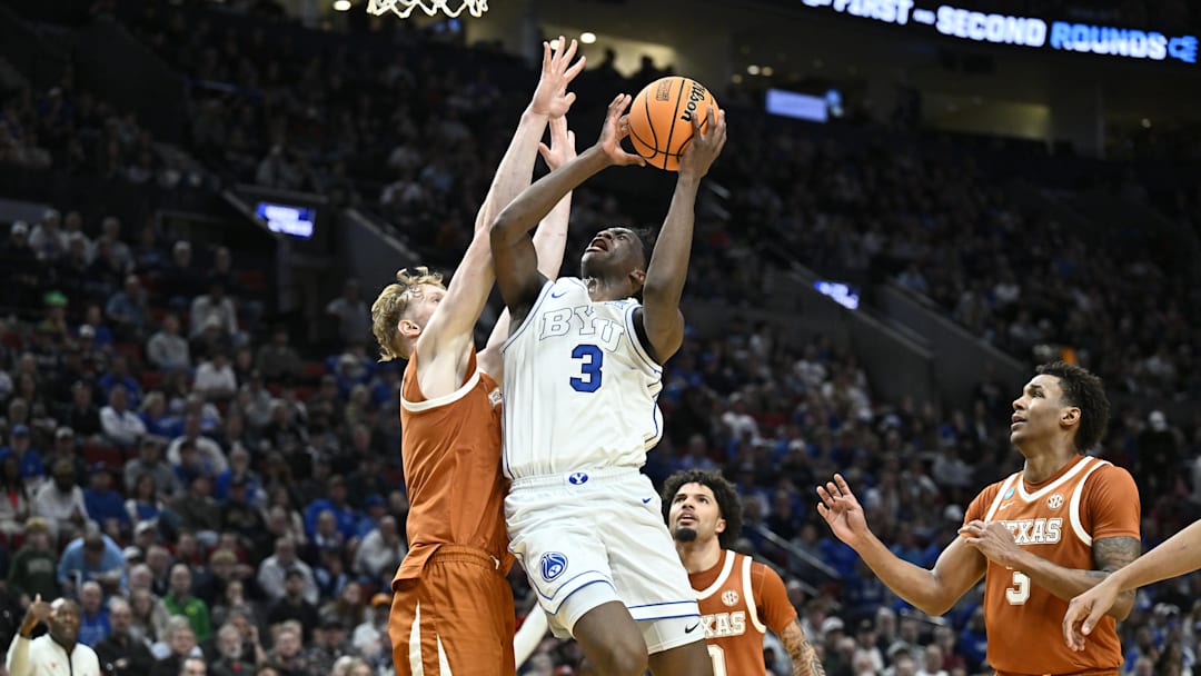 Mar 19, 2026; Portland, OR, USA; BYU Cougars forward AJ Dybantsa (3) shoots against Texas Longhorns center Matas Vokietaitis (8) in the first half during a first round game of the men's 2026 NCAA Tournament at Moda Center. Mandatory Credit: Craig Strobeck-Imagn Images