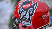 Nov 11, 2023; Winston-Salem, North Carolina, USA; The North Carolina State Wolfpack helmet rests on the bench during the second half against the Wake Forest Demon Deacons at Allegacy Federal Credit Union Stadium. Mandatory Credit: William Howard-Imagn Images