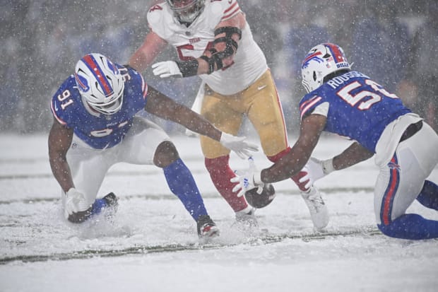Buffalo Bills Ed Oliver and Greg Rousseau attempt to recover a fumble against the San Francisco 49ers
