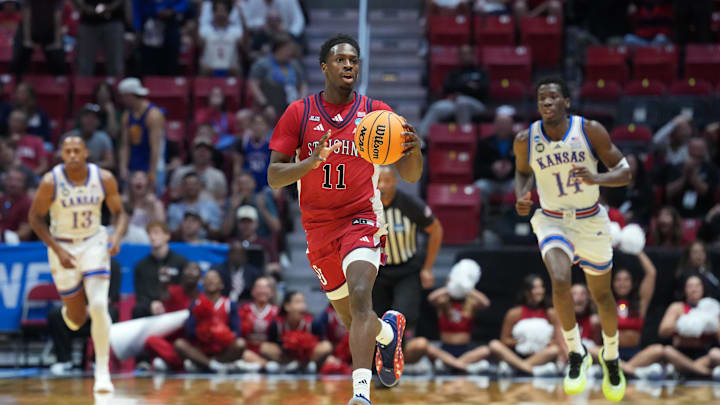 Mar 22, 2026; San Diego, CA, USA; St. John's basketball guard Ian Jackson (11) controls the ball against the Kansas Jayhawks in the first half during a second round game of the men's 2026 NCAA Tournament at Viejas Arena.
