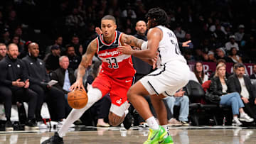 Oct 14, 2024; Brooklyn, New York, USA; Washington Wizards small forward Kyle Kuzma (33) dribbles the ball against Brooklyn Nets small guard Cam Thomas (24) during the second half at Barclays Center. Mandatory Credit: Gregory Fisher-Imagn Images