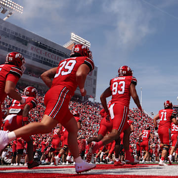 The Utah Utes run out on the field before the game against the Baylor Bears at Rice-Eccles Stadium.