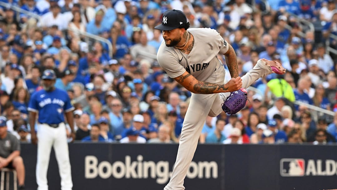 Oct 4, 2025; Toronto, Ontario, CAN; New York Yankees pitcher Luis Gil (81) throws in the first inning against the Toronto Blue Jays during game one of the ALDS round for the 2025 MLB playoffs at Rogers Centre. Mandatory Credit: Dan Hamilton-Imagn Images