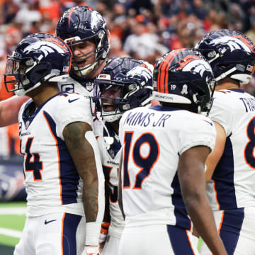 Dec 3, 2023; Houston, Texas, USA; Denver Broncos wide receiver Courtland Sutton (14) celebrates his touchdown reception with teammates against the Houston Texans in the second half at NRG Stadium. Mandatory Credit: Thomas Shea-USA TODAY Sports