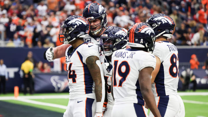 Dec 3, 2023; Houston, Texas, USA; Denver Broncos wide receiver Courtland Sutton (14) celebrates his touchdown reception with teammates against the Houston Texans in the second half at NRG Stadium. Mandatory Credit: Thomas Shea-USA TODAY Sports