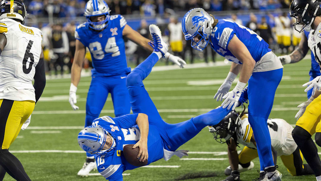 Dec 21, 2025; Detroit, Michigan, USA; Detroit Lions quarterback Jared Goff (16) attempts to make a catch during the fourth quarter against the Pittsburgh Steelers at Ford Field. Mandatory Credit: David Reginek-Imagn Images