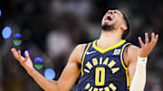Oct 30, 2024; Indianapolis, Indiana, USA; Indiana Pacers guard Tyrese Haliburton (0) reacts to after scoring a three point basket during a game against the Boston Celticss at Gainbridge Fieldhouse. Mandatory Credit: Grace Smith-Imagn Images