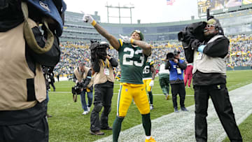 Oct 13, 2024; Green Bay, Wisconsin, USA;  Green Bay Packers cornerback Jaire Alexander (23) celebrates following the game against the Arizona Cardinals at Lambeau Field. Mandatory Credit: Jeff Hanisch-Imagn Images