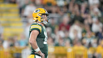 Aug 9, 2025; Green Bay, Wisconsin, USA;  Green Bay Packers quarterback Sean Clifford (16) reacts to a holding call during the second half against the New York Jets at Lambeau Field. Mandatory Credit: Kayla Wolf-Imagn Images