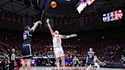 Feb 17, 2025; Salt Lake City, Utah, USA; Kansas State Wildcats guard Brendan Hausen (11) shoots over Utah Utes guard Gabe Madsen (55) during the first half at Jon M. Huntsman Center. Mandatory Credit: Rob Gray-Imagn Images