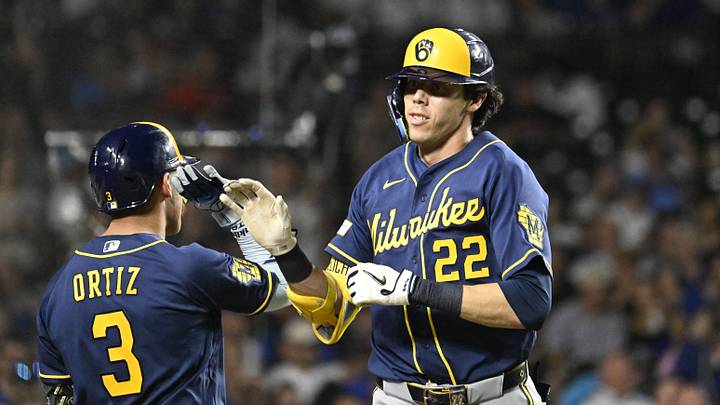 Sep 1, 2026; Chicago, Illinois, USA;  Milwaukee Brewers shortstop Joey Ortiz (3) high fives  designated hitter Christian Yelich (22) after  his two run home run during the sixth inning against the Chicago Cubs  at Wrigley Field.  Mandatory Credit: Matt Marton-Imagn Images