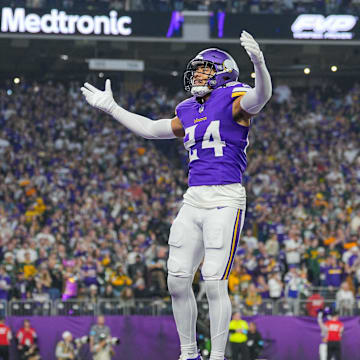 Dec 29, 2024; Minneapolis, Minnesota, USA; Minnesota Vikings safety Camryn Bynum (24) interacts with fans against Green Bay Packers in the first quarter at U.S. Bank Stadium. Mandatory Credit: Brad Rempel-Imagn Images