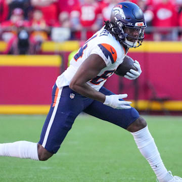 Nov 10, 2024; Kansas City, Missouri, USA; Denver Broncos wide receiver Lil'Jordan Humphrey (84) runs the ball as Kansas City Chiefs safety Bryan Cook (6) defends during the game at GEHA Field at Arrowhead Stadium. 