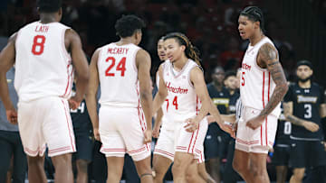 Nov 8, 2025; Houston, Texas, USA; Houston Cougars guard Kingston Flemings (4) celebrates with teammates after scoring during the second half against the Towson Tigers at Fertitta Center. Mandatory Credit: Troy Taormina-Imagn Images