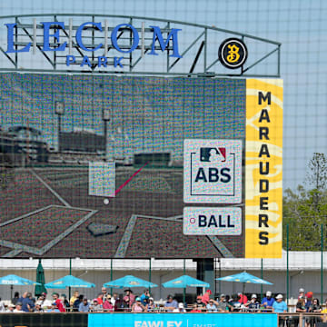 The scoreboard at LECOM Park displays a screen from the ABS challenge system, indicating the path of the challenged pitch and the strike zone for the individual player. Major League Baseball is testing an Automated Ball-Stike (ABS) challenge system at select spring training parks. The system allows players to challenge a limited number of ball/stike calls during a game. Calls can be overturned if the pitch tracking technology shows an umpire got a call wrong.