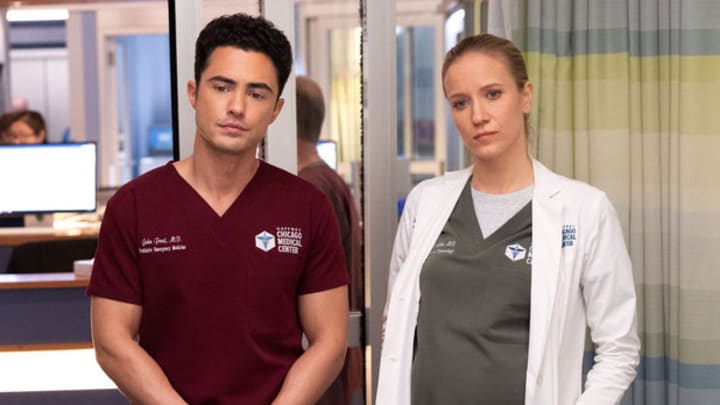 CHICAGO MED -- "Spill Your Guts" Episode 1112 -- Pictured: (l-r) Darren Barnet as Dr. John Frost, Jessy Schram as Dr. Hannah Asher 